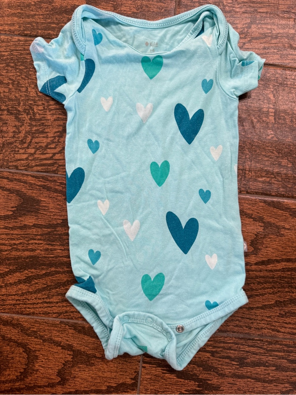 Kyte BABY Aqua Heart Print One-Piece Bodysuit
